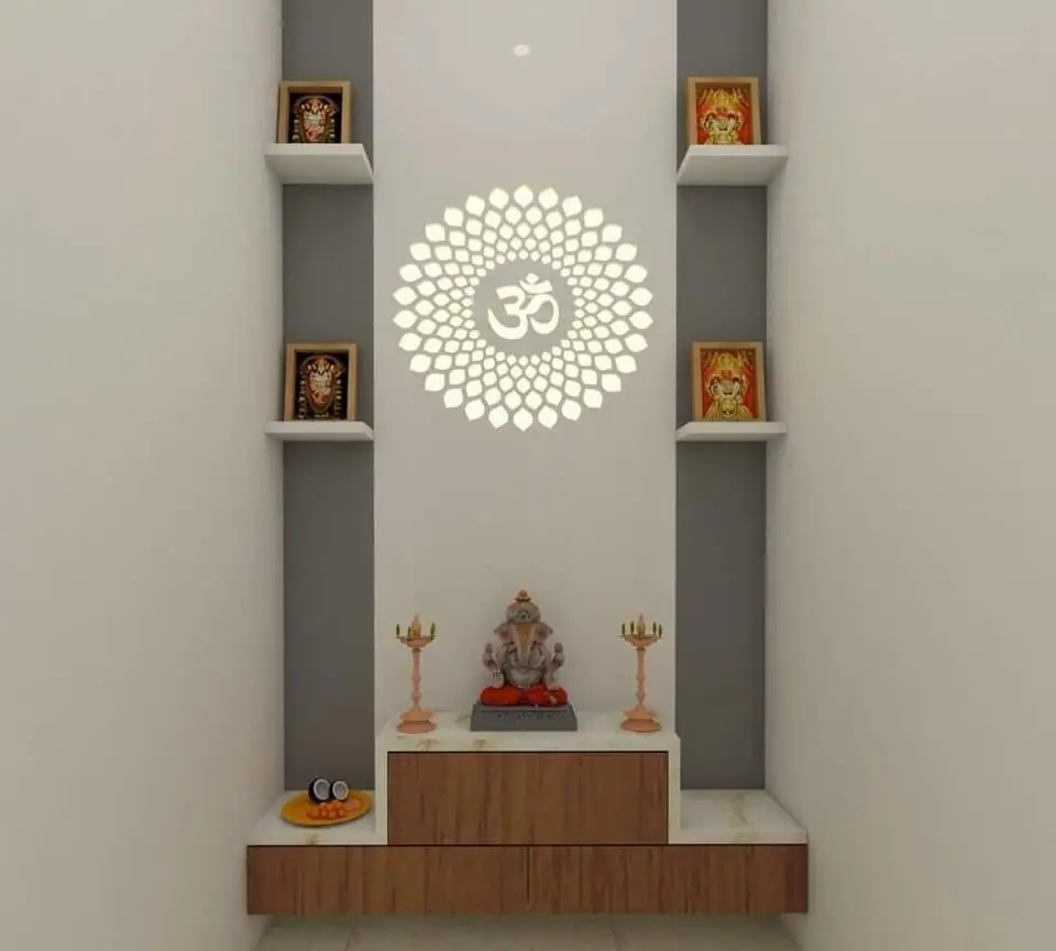 Wall-mounted mandir design with an Om jali disc and display niches